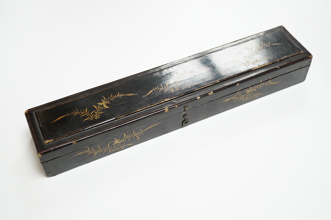 Four 19th century Chinese gilt-decorated black lacquer fans with figure painted leaves, two cased, largest 41cm